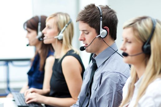 Attractive young man working in a call center